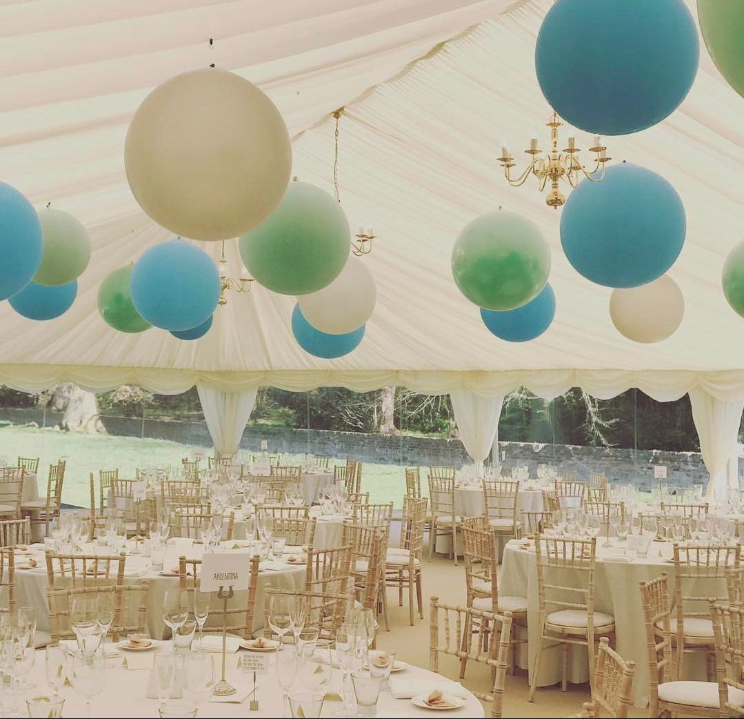 classic marquees york chandelier whimsical wedding marquee hire gold chairs balloons bride and groom 